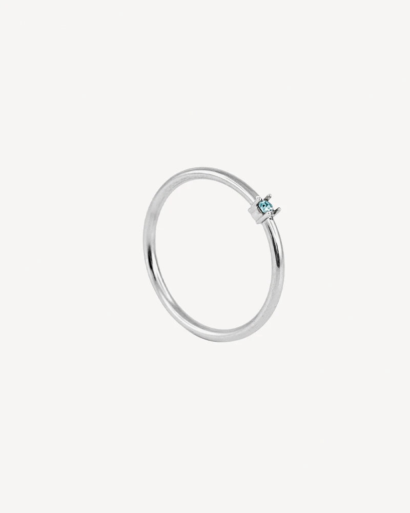 ANILLO JIRAF PLATEADO PIEDRA CELESTE