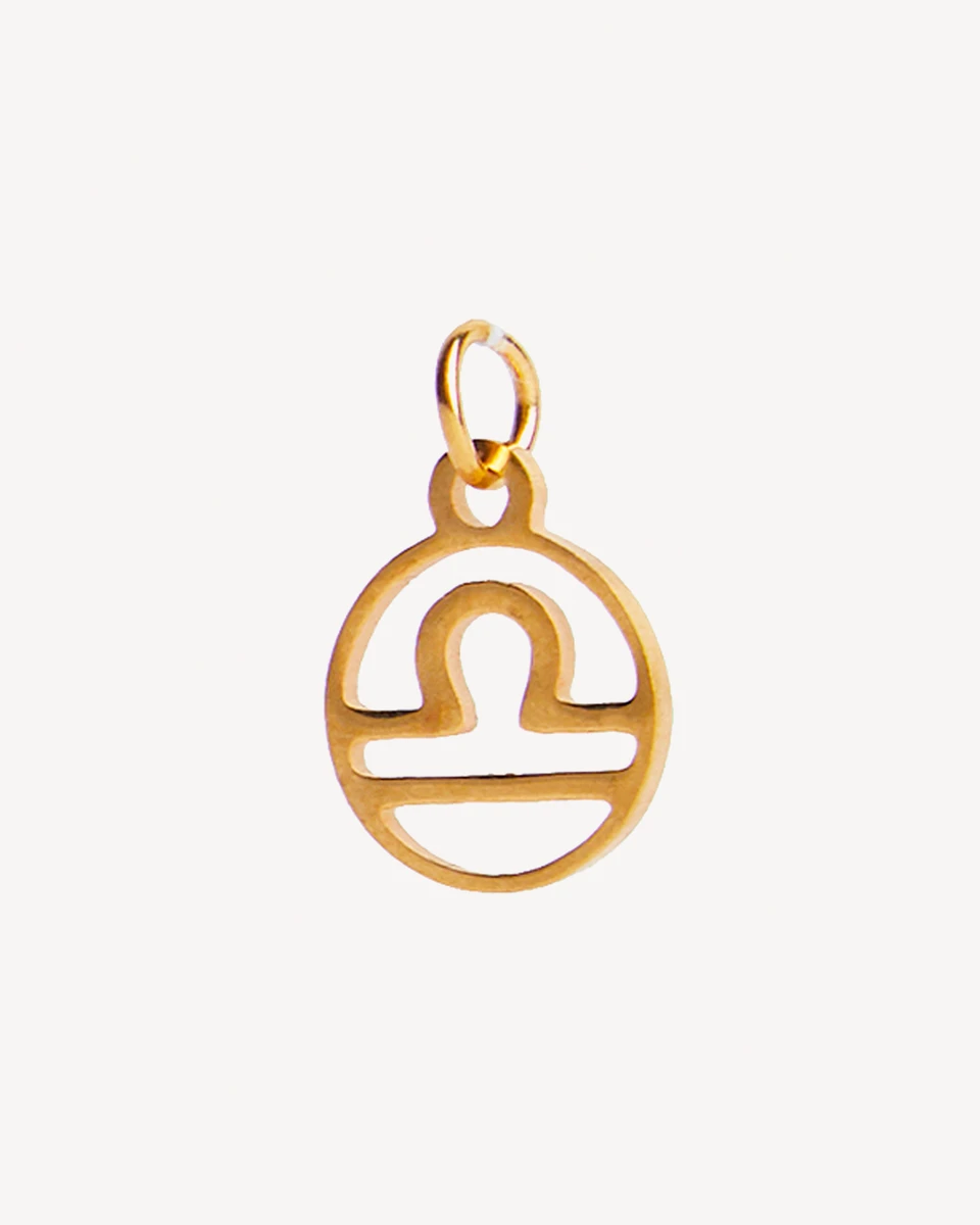 DIJE LIBRA ACERO - DORADO 